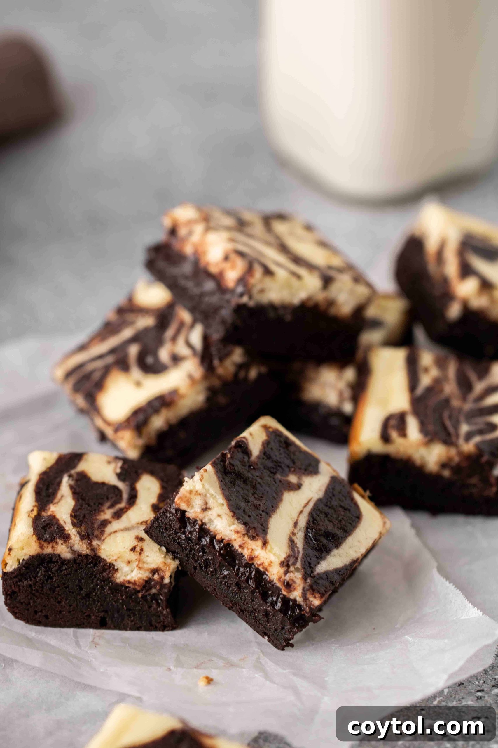 Decadent Fudgy Cheesecake Brownies 14 Easy display of perfectly cut cream cheese brownies on a platter