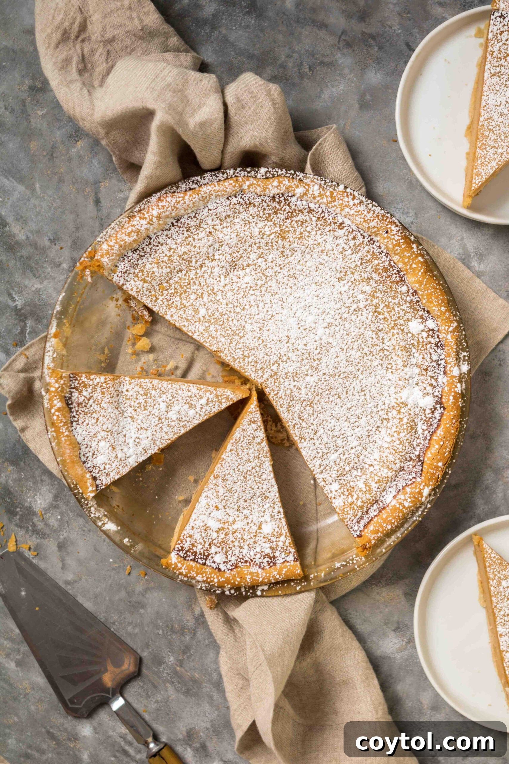 A freshly baked Southern Sweet Potato Pie, perfectly golden and ready to be sliced, a classic Thanksgiving dessert.