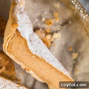 A delicious slice of Southern Sweet Potato Pie, showcasing its golden crust and creamy filling.