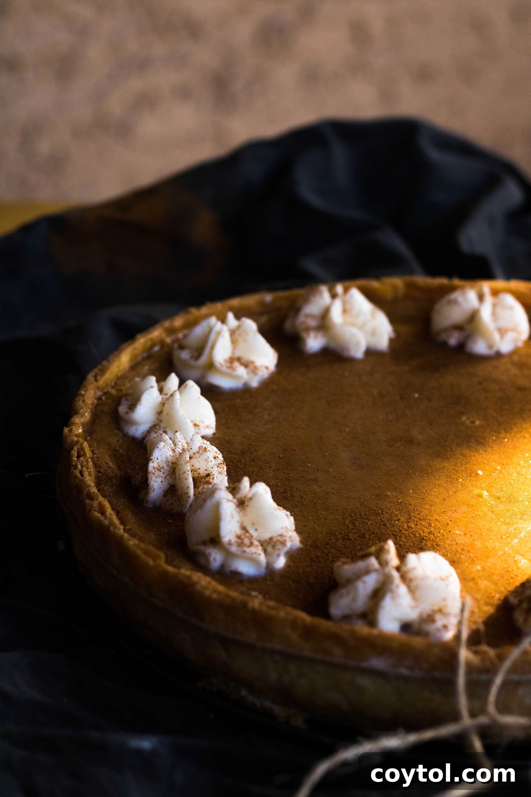 An older, less refined photo of a homemade sweet potato pie from 2018, showing a rustic appearance.