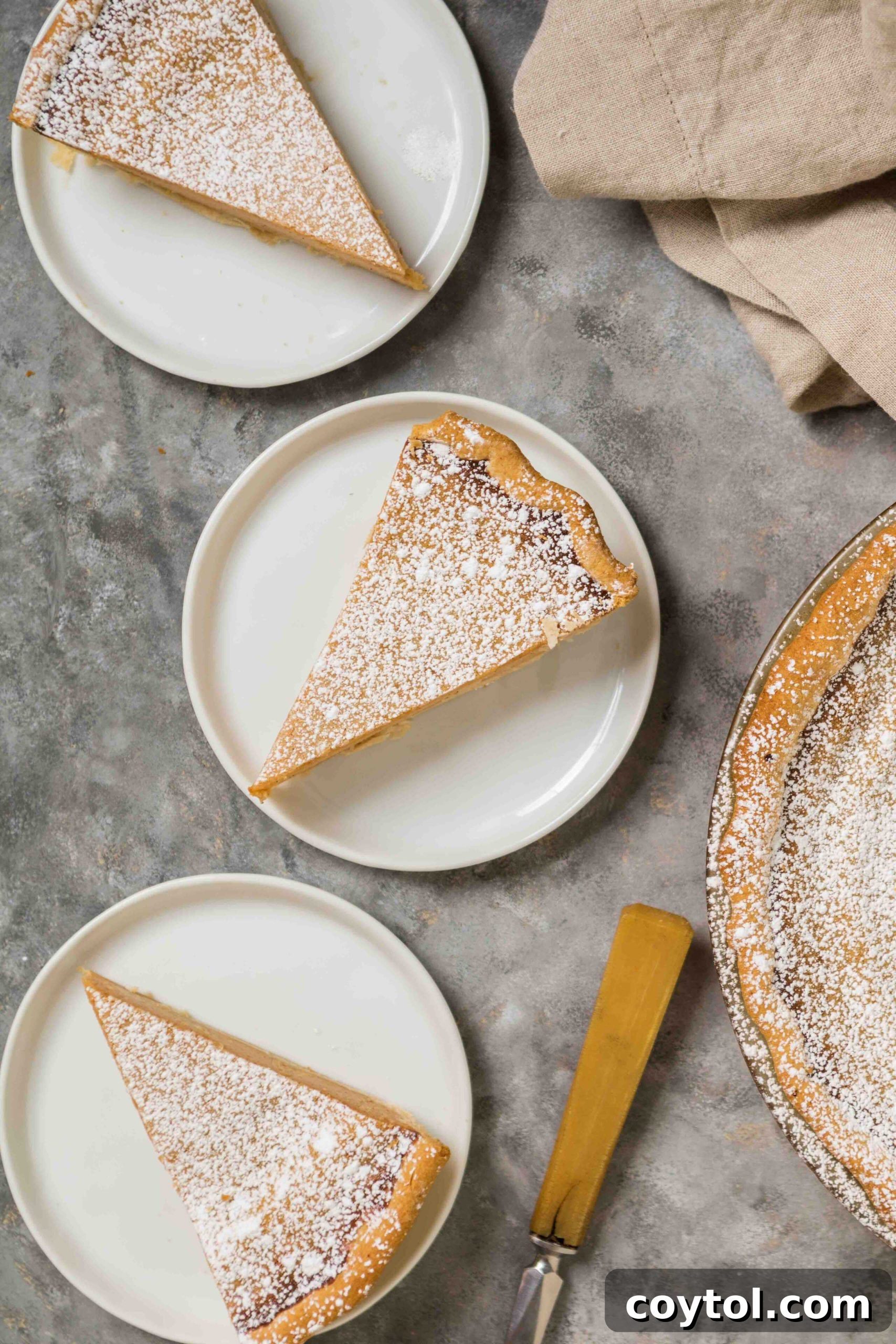 An overhead view of three perfectly baked and sliced Southern Sweet Potato Pie pieces, ready for serving.