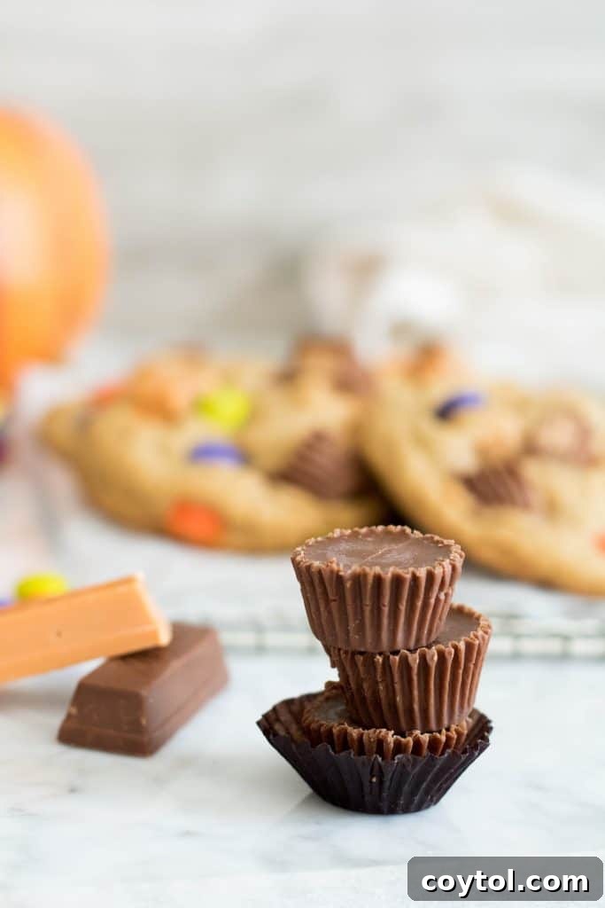 Close-up of three stacked Reese's mini chocolates, showcasing the variety of candy used