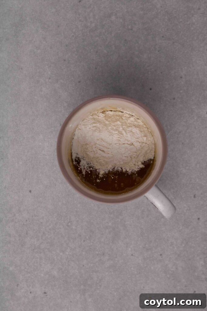 How to make a sugar cookie in a mug: adding flour and corn starch