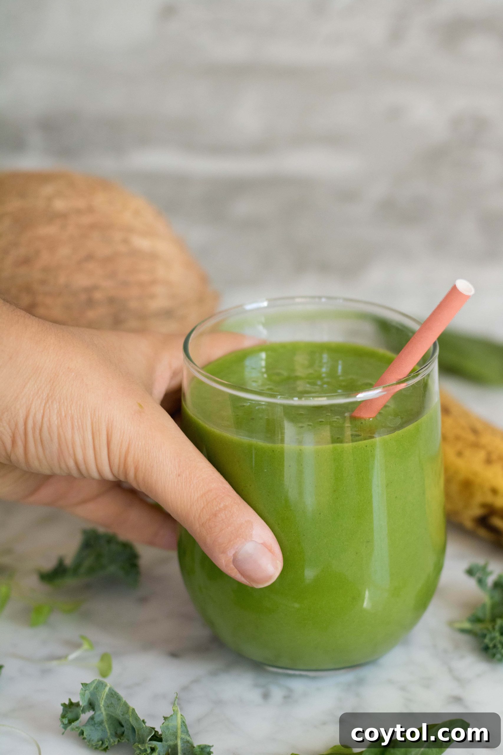Spinach and Kale smoothie for breakfast in a modern glass