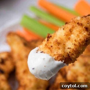 Air fryer chicken tenders dipped in ranch