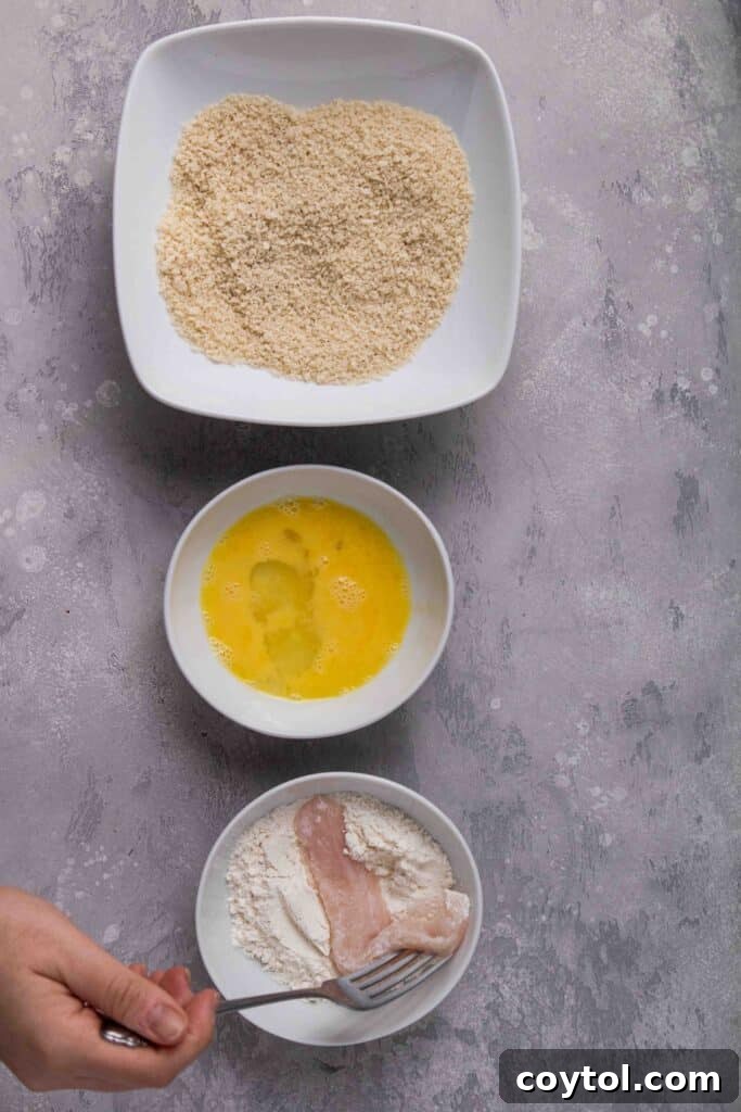 Coat the chicken tenders in flour