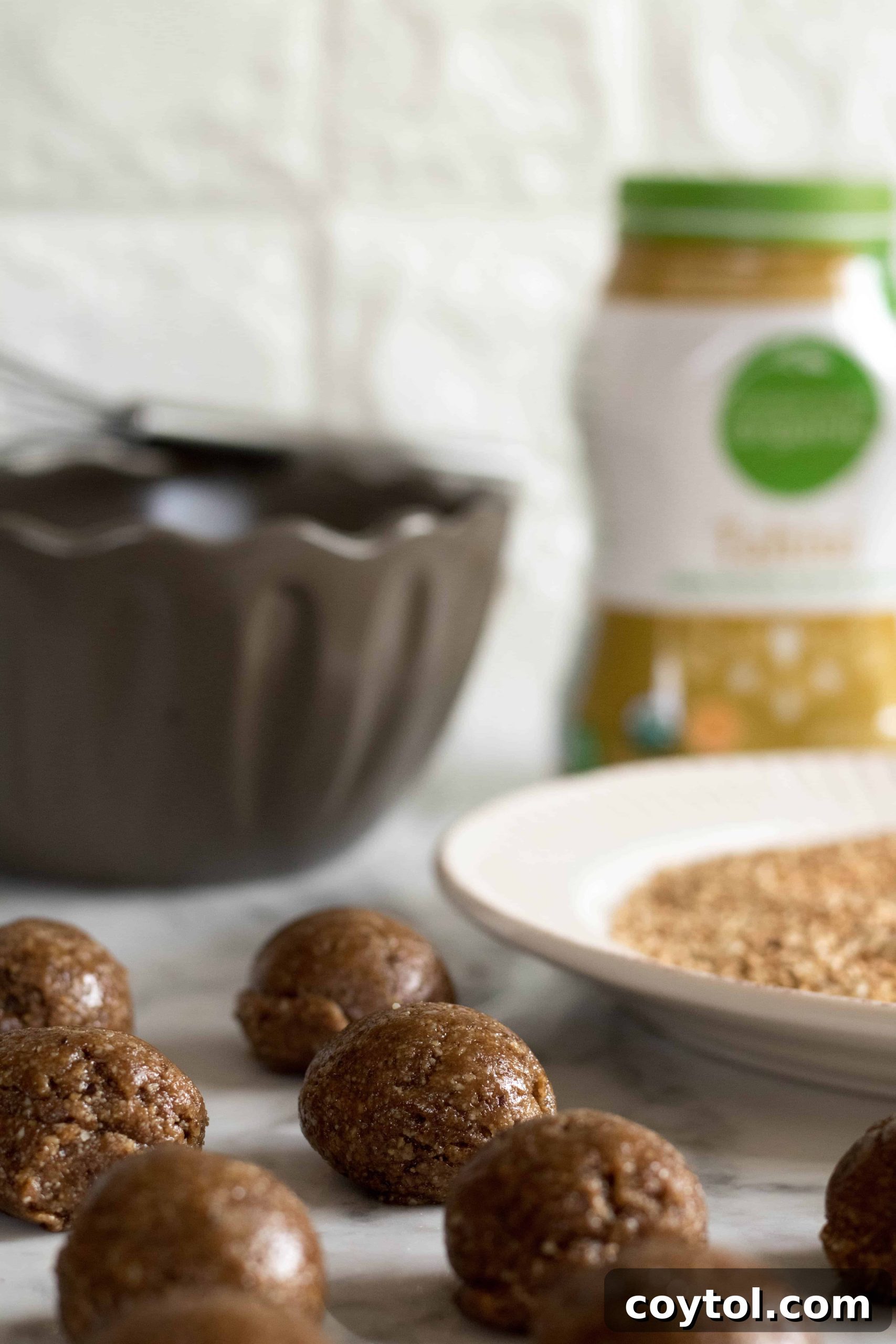 Rolling tahini cookie dough into perfect balls in your hand.