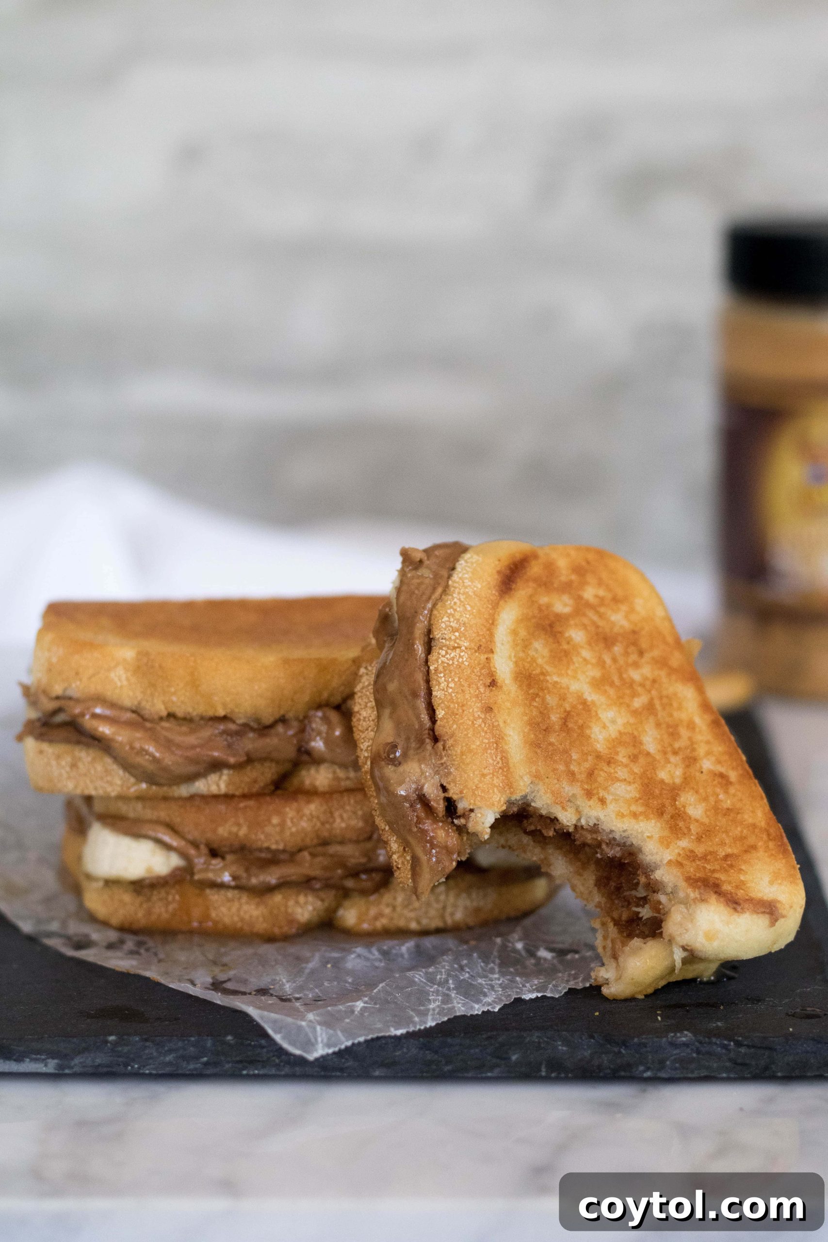 The best Grilled Peanut Butter and Banana Sandwich, with a bite taken out