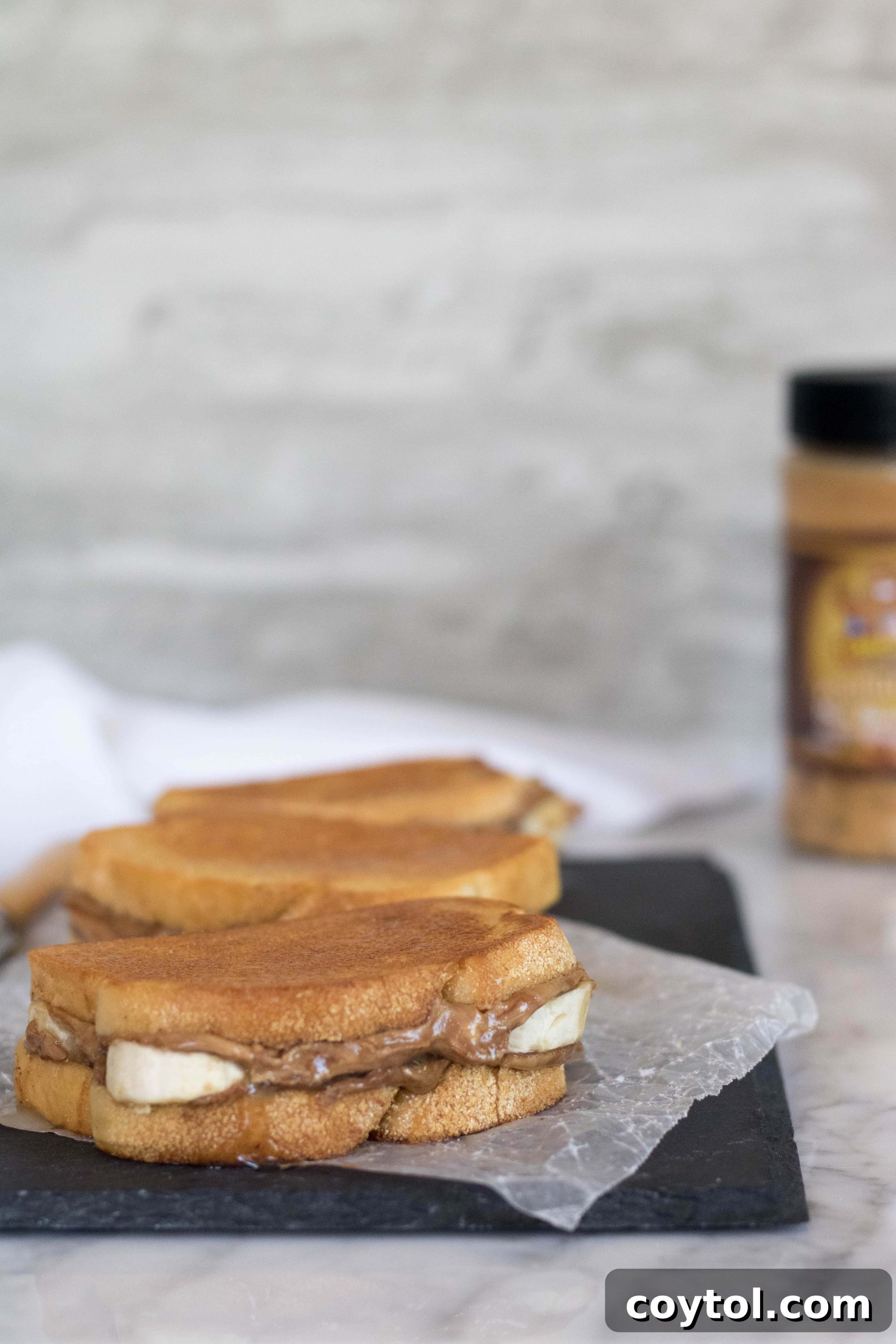 A perfect trio of grilled banana sandwiches, stacked and ready to serve