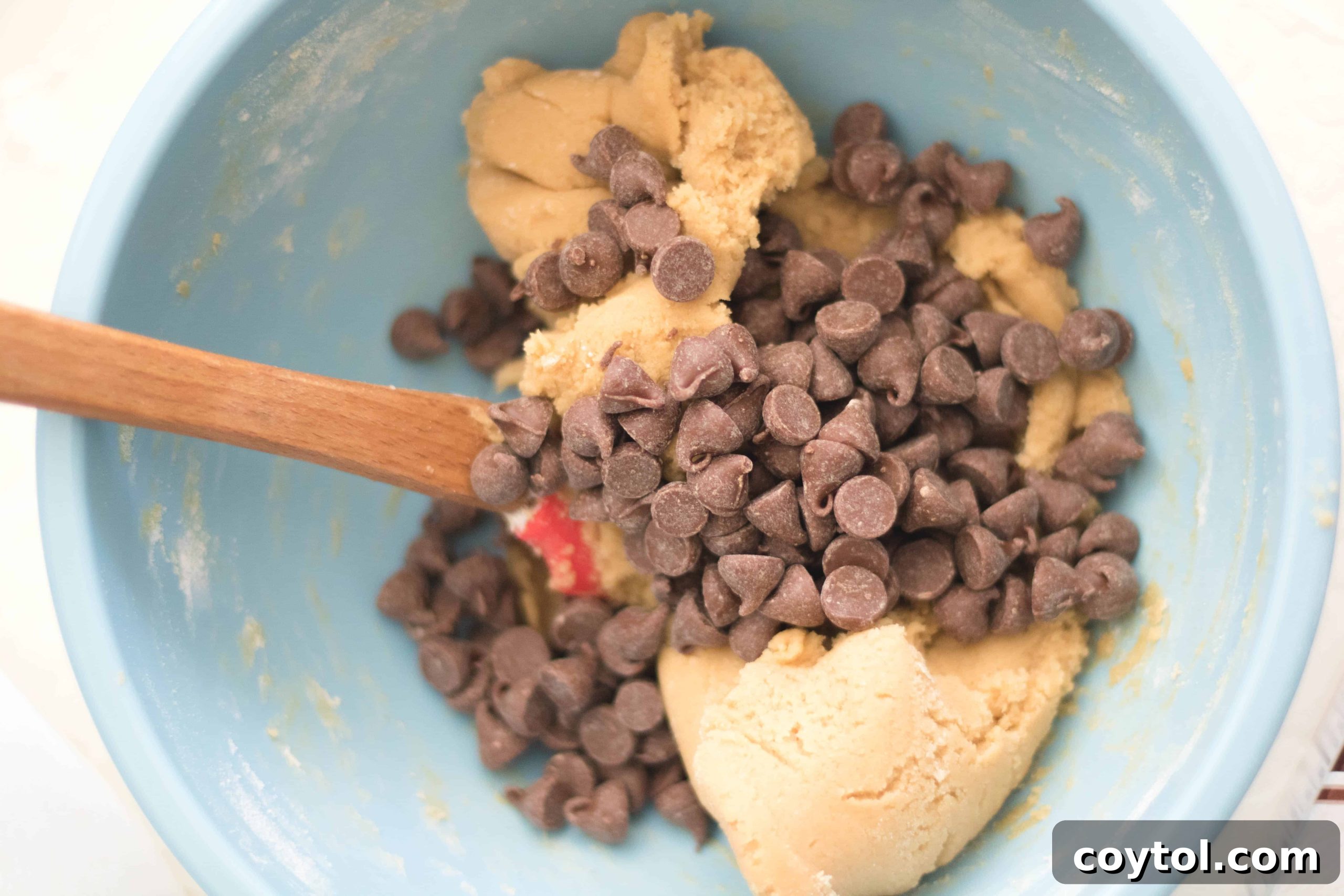 Folding chocolate chips into the cookie dough