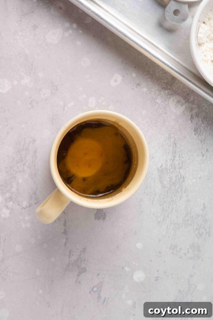 The Ultimate Single-Serve Banana Bread Mug Cake 7 Add the brown sugar and the egg yolk to the mug