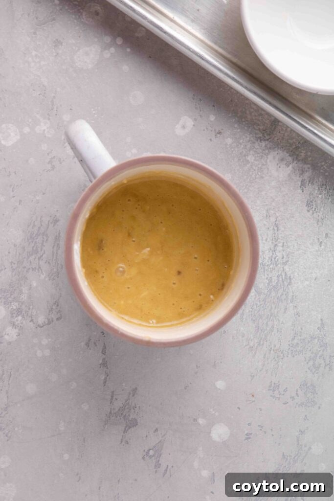 The Ultimate Single-Serve Banana Bread Mug Cake 10 Add the dry ingredients to the mug cake mixture
