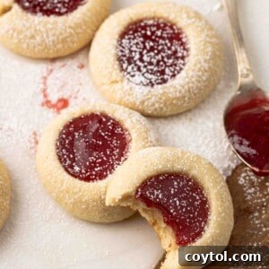 Strawberry thumbprint cookies recipe image, showcasing their perfect bake and vibrant filling.