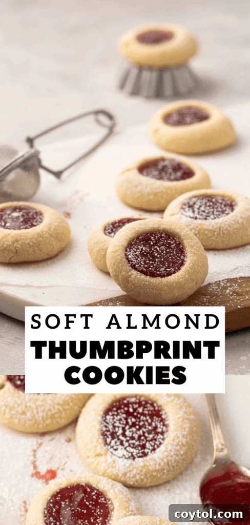 Pin image: Close-up of jam-filled thumbprint cookies on a cooling rack, showcasing the tender texture.