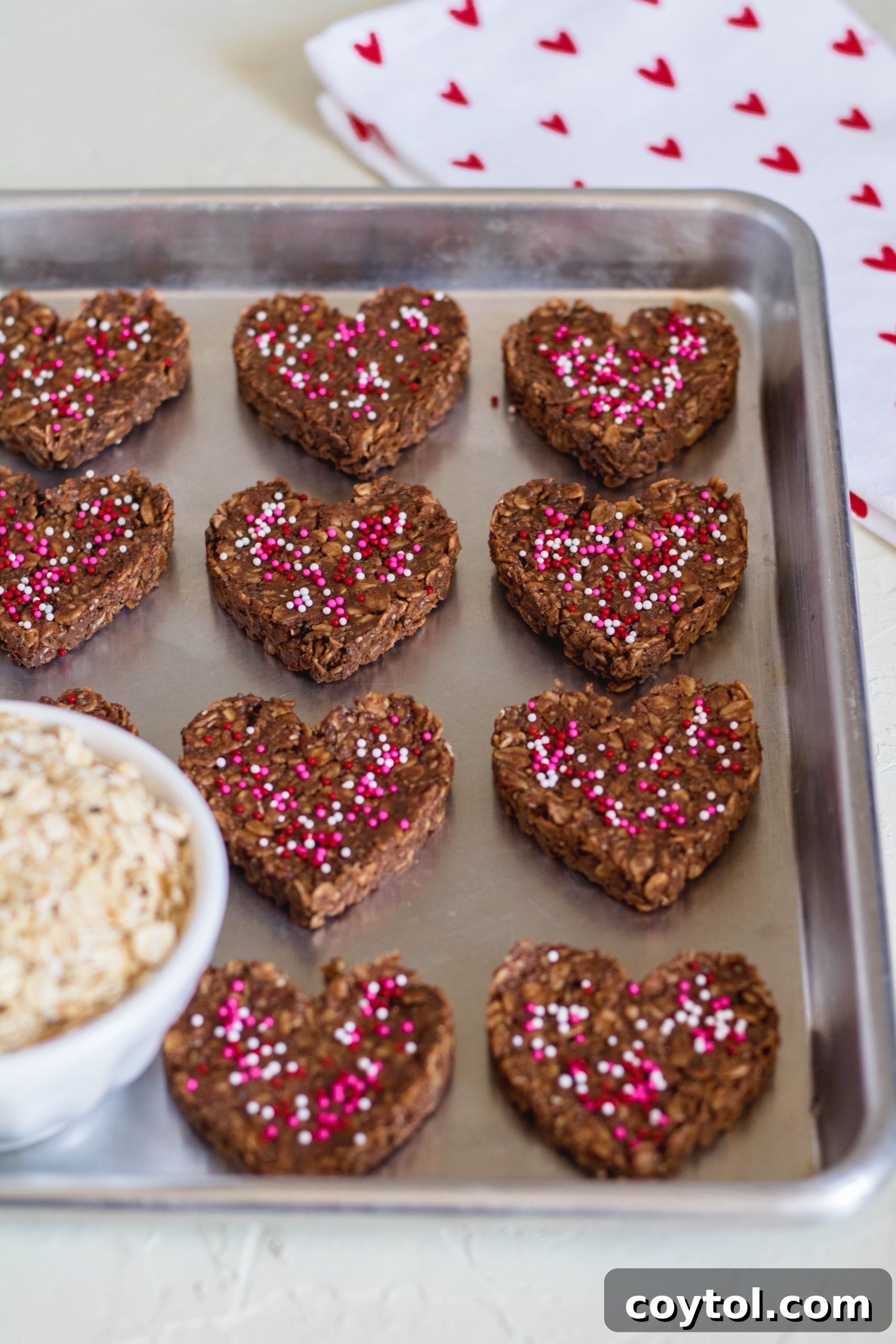 18 Easy No-Bake Valentine Treats for Kids 21 A collage of 18 easy no-bake Valentine's Day cookie recipes for kids, featuring various treats.