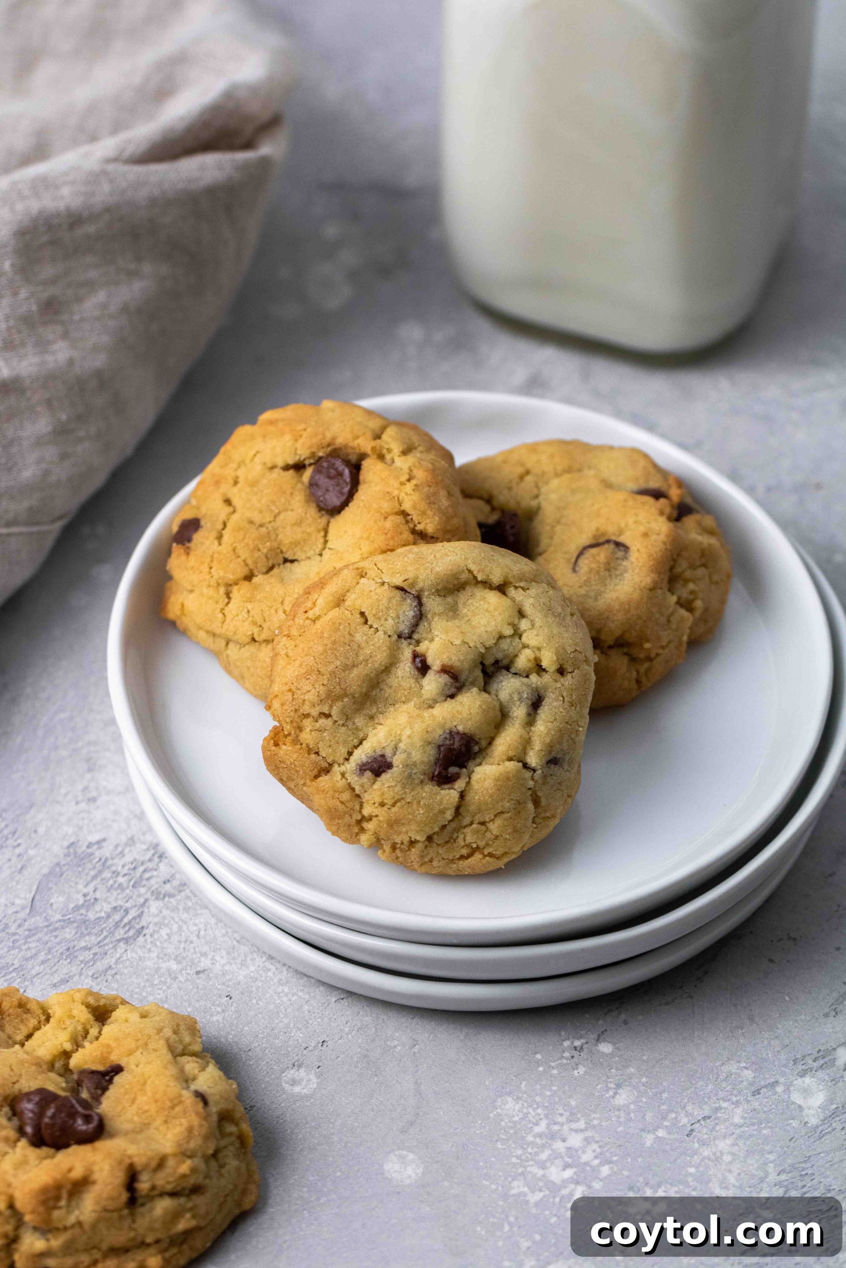 Freshly baked air-fried chocolate chip cookies arranged neatly on a serving plate.