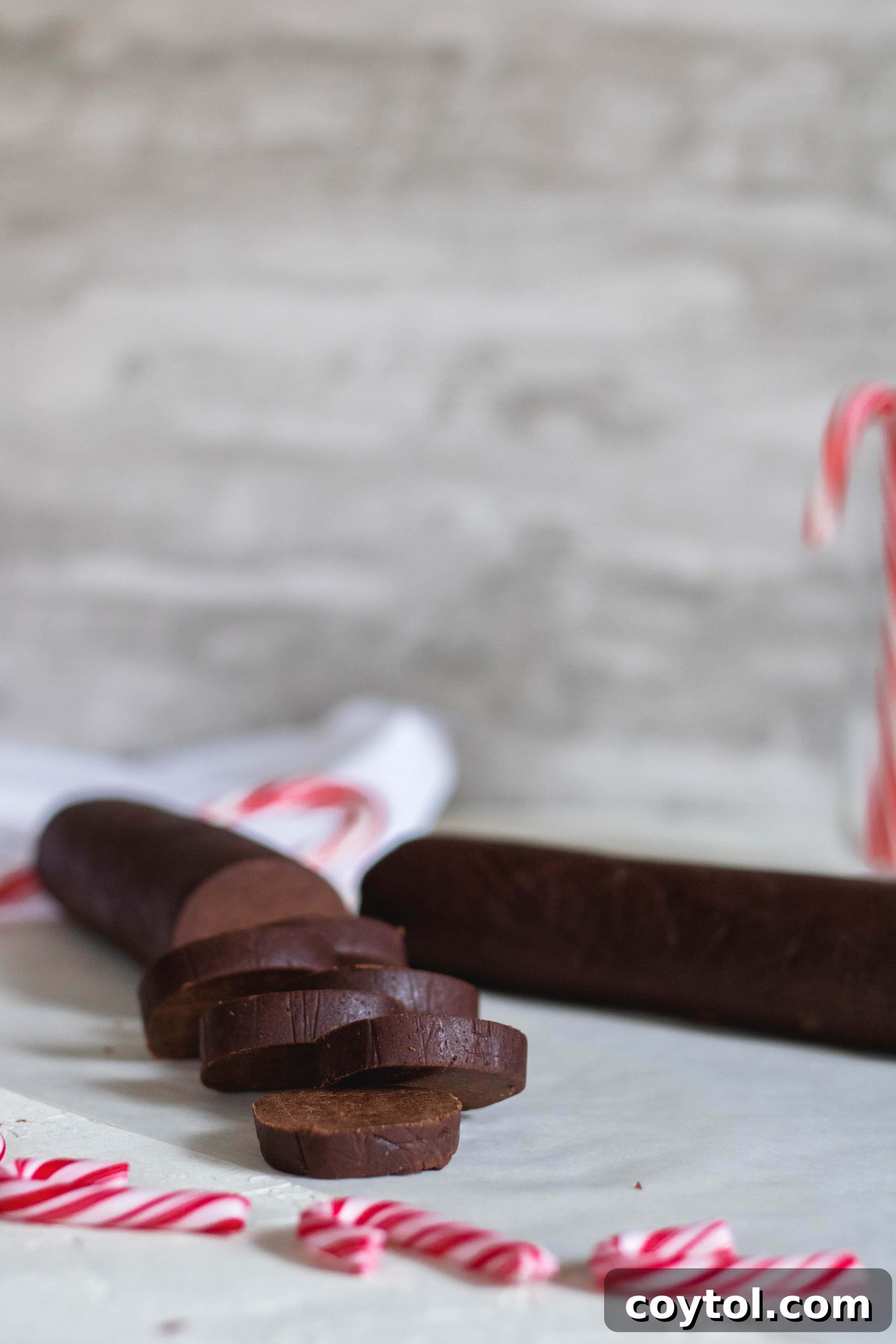 Slicing chilled chocolate peppermint crunch cookie dough