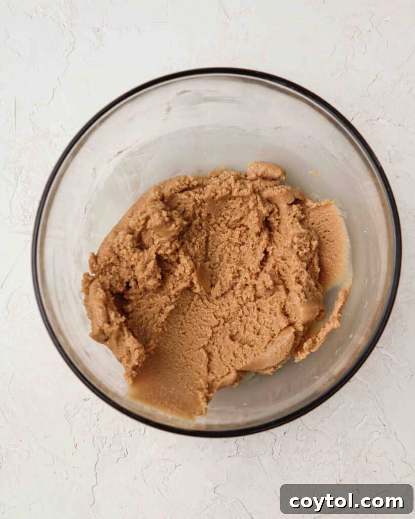 Forming the no-bake 3-ingredient peanut butter cookies