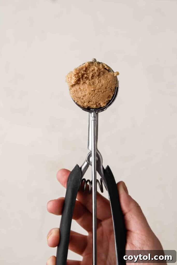 Peanut butter cookie dough in a cookie scooper