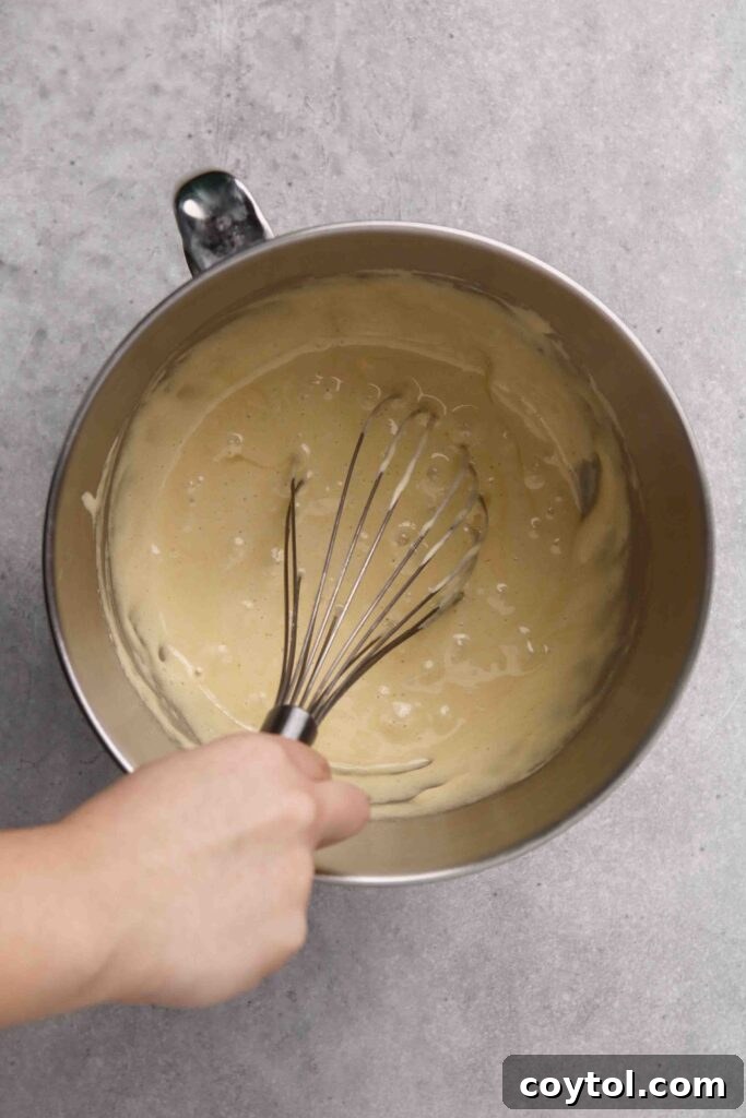 Add in the melted white chocolate mixture to the egg mixture