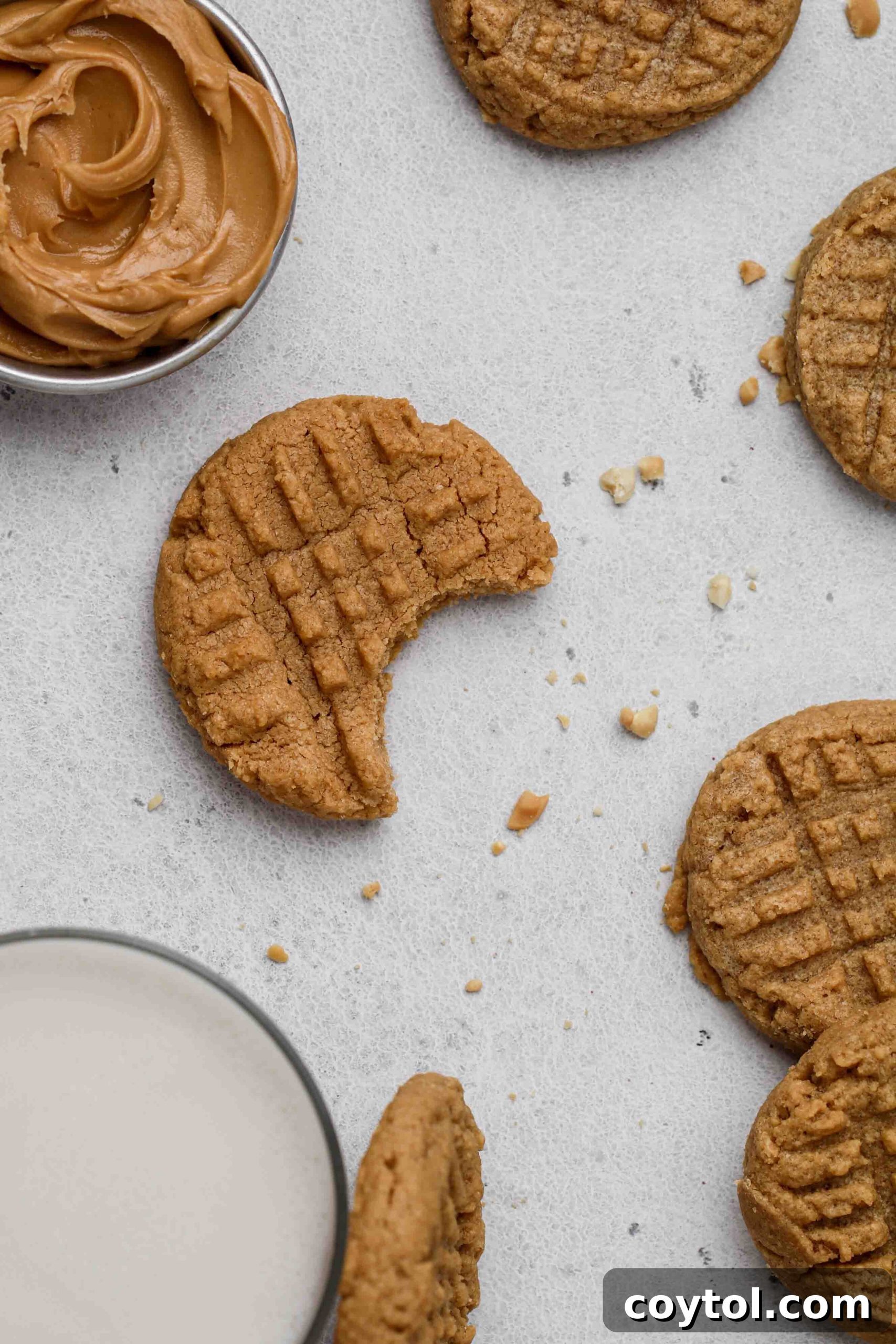 A soft, chewy peanut butter cookie with a bite taken out of it, revealing its rich texture and inviting golden-brown color.