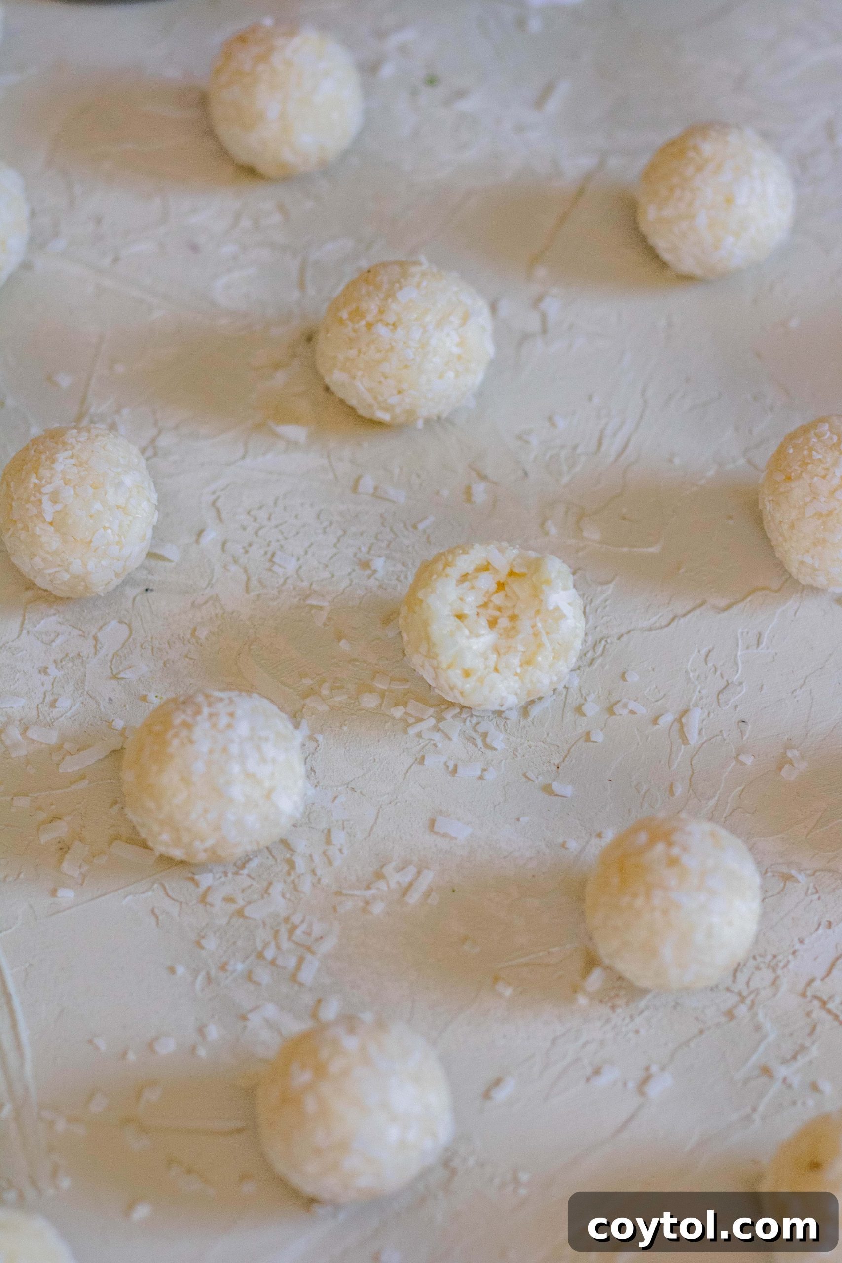 Coconut balls recipe no bake, stored in an airtight container for freshness.