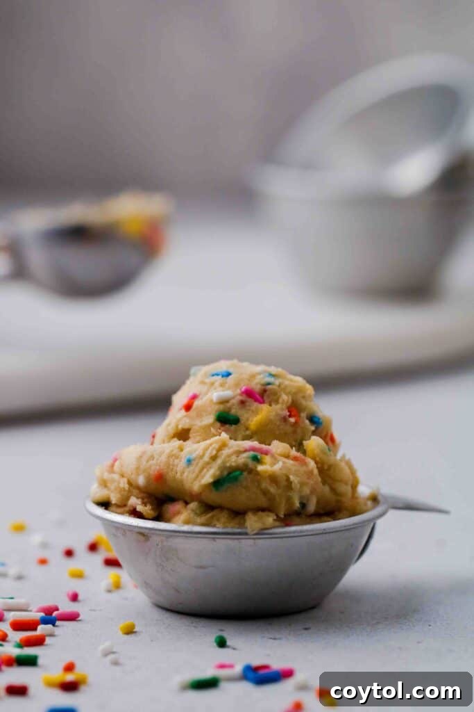 Scoop of edible sprinkles cookie dough in a bowl