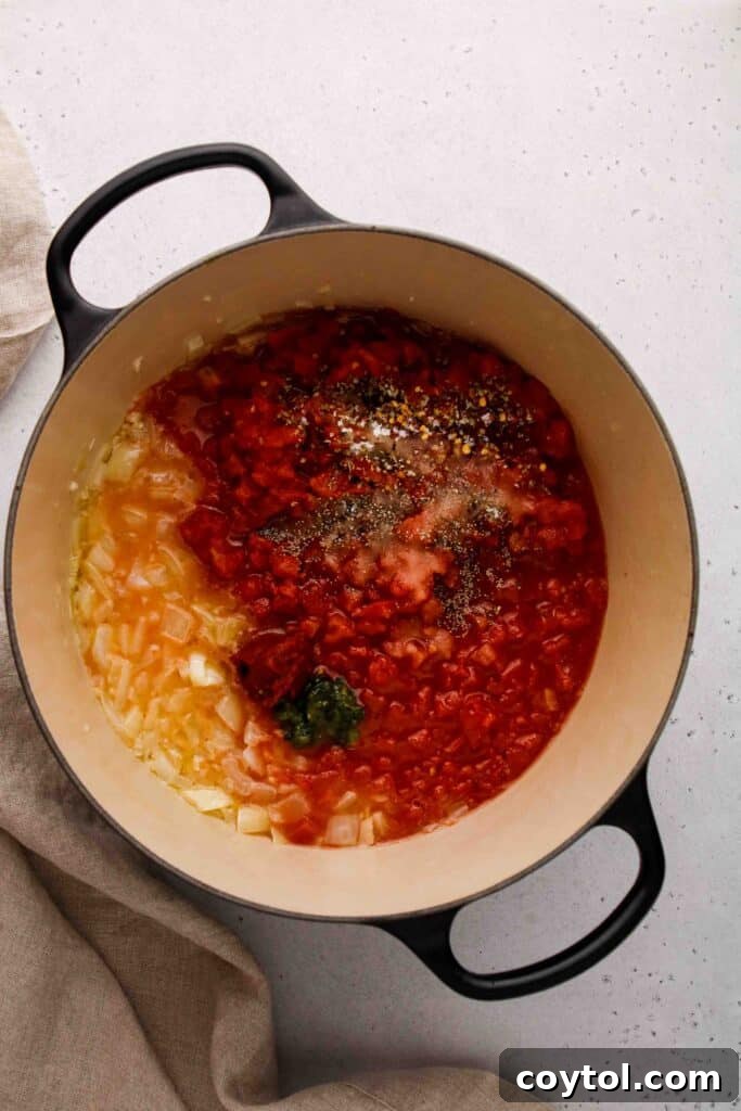 Speedy Homemade Marinara in 30 Minutes 7 Adding crushed tomatoes to the sautéed onion and garlic mixture.