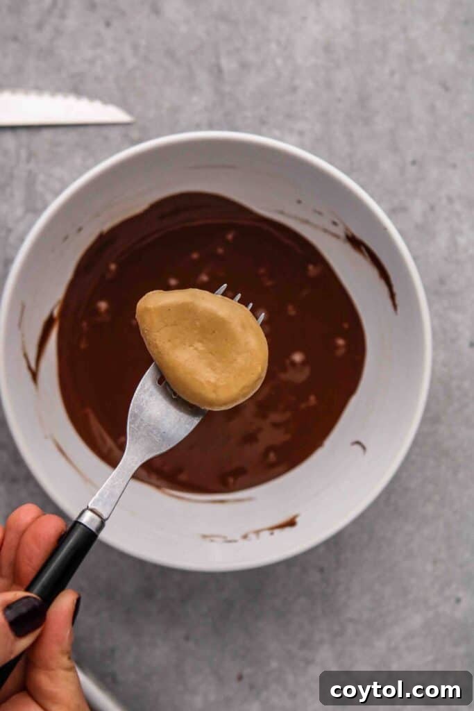 Freeze the peanut butter eggs before dipping in chocolate