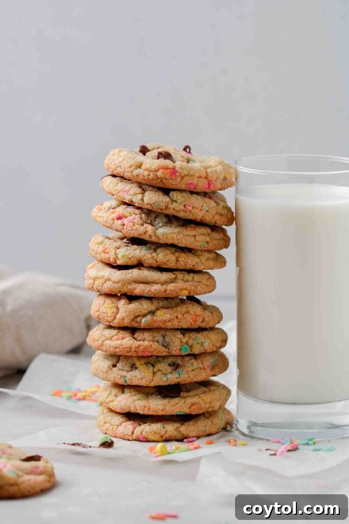 Stack of Easter chocolate chip cookies with festive sprinkles, hinting at soft and chewy texture.