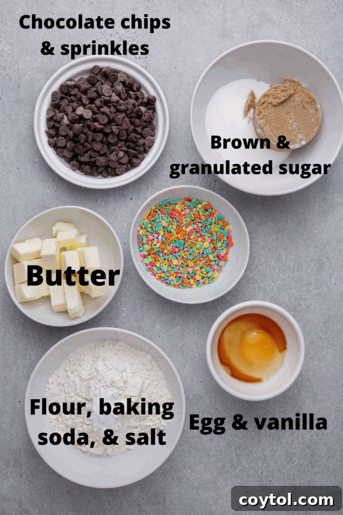 A trio of perfectly baked Easter chocolate chip cookies, showcasing their golden edges and colorful sprinkles.