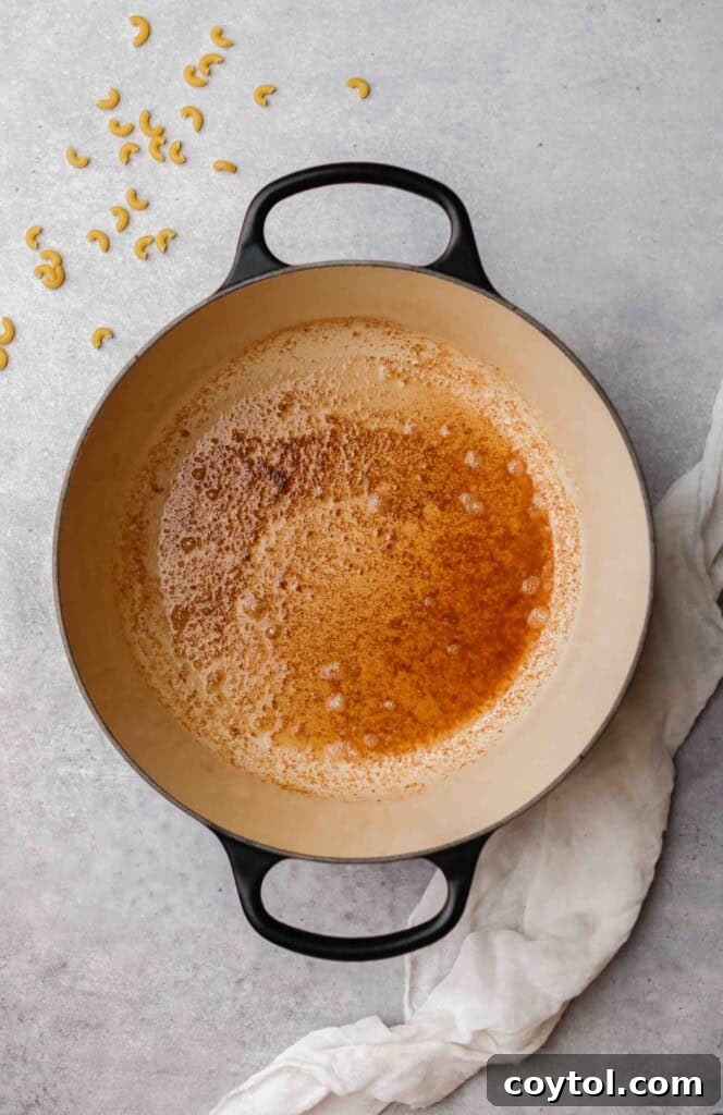 Unforgettable Stovetop Mac and Cheese 4 Melted butter in a le creuset pot