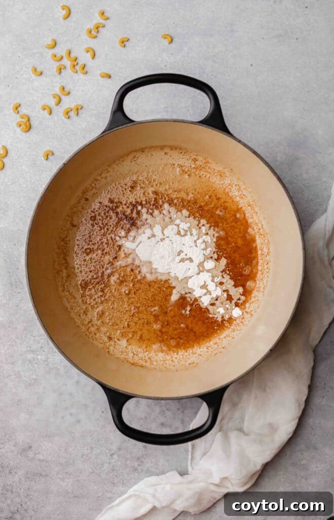 Unforgettable Stovetop Mac and Cheese 5 Melted butter and flour cooking in a pot