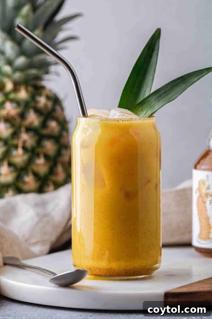Iced golden ginger drink with fresh ingredients