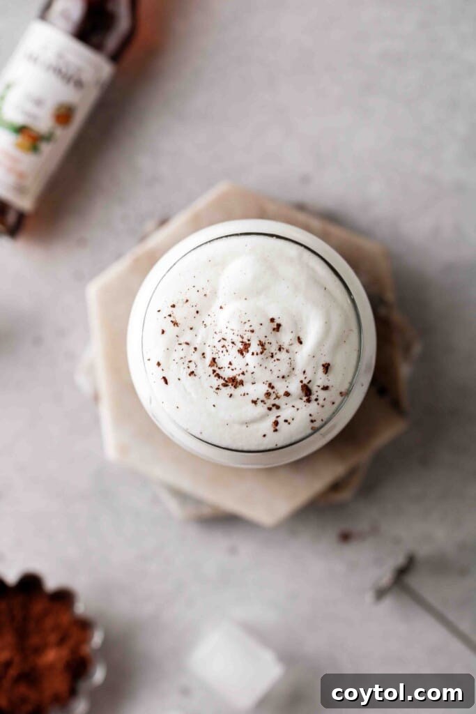 The Ultimate Starbucks Irish Cream Cold Brew 12 Overhead shot of vanilla sweet cream with cocoa powder