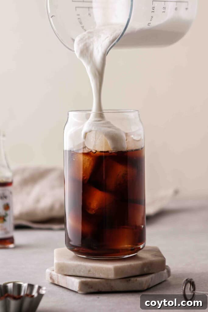 The Ultimate Starbucks Irish Cream Cold Brew 3 Pouring vanilla sweet cream over cold brew coffee