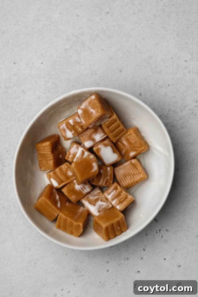 Caramels and heavy cream in a bowl