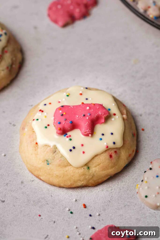 Pillowy Soft Crumbl Circus Animal Cookies 10 Crumbl circus animal cookies with white chocolate topping before the animal cookie is added.