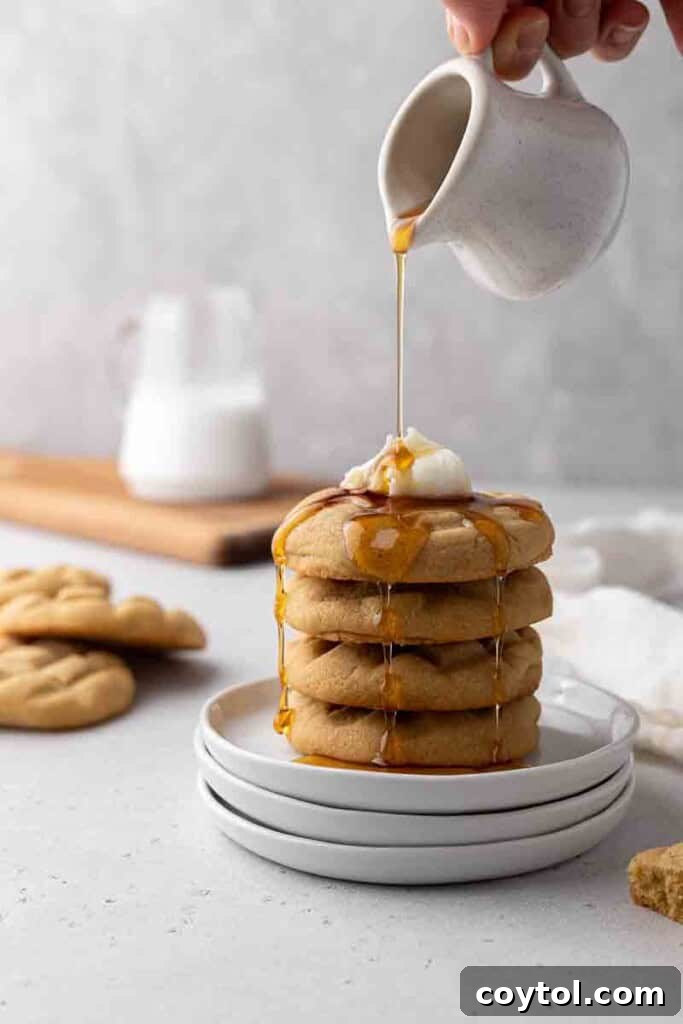 CRUMBL Waffle Cookies Crowned with Buttercream 11 Pouring syrup over waffle cookies