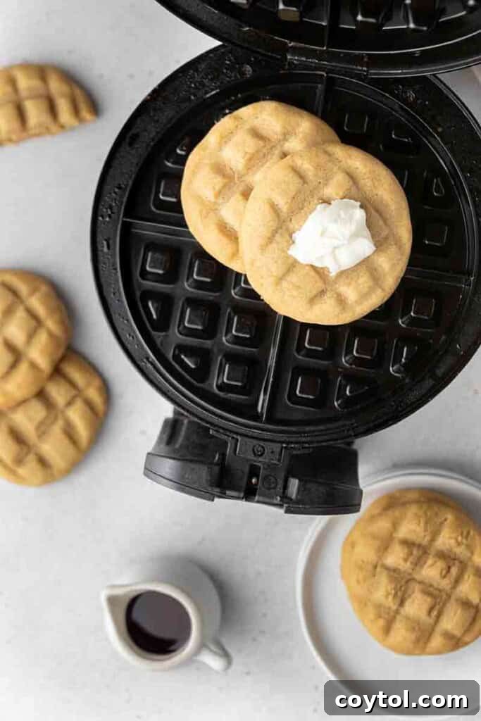 CRUMBL Waffle Cookies Crowned with Buttercream 12 Waffle cookies on a waffle iron