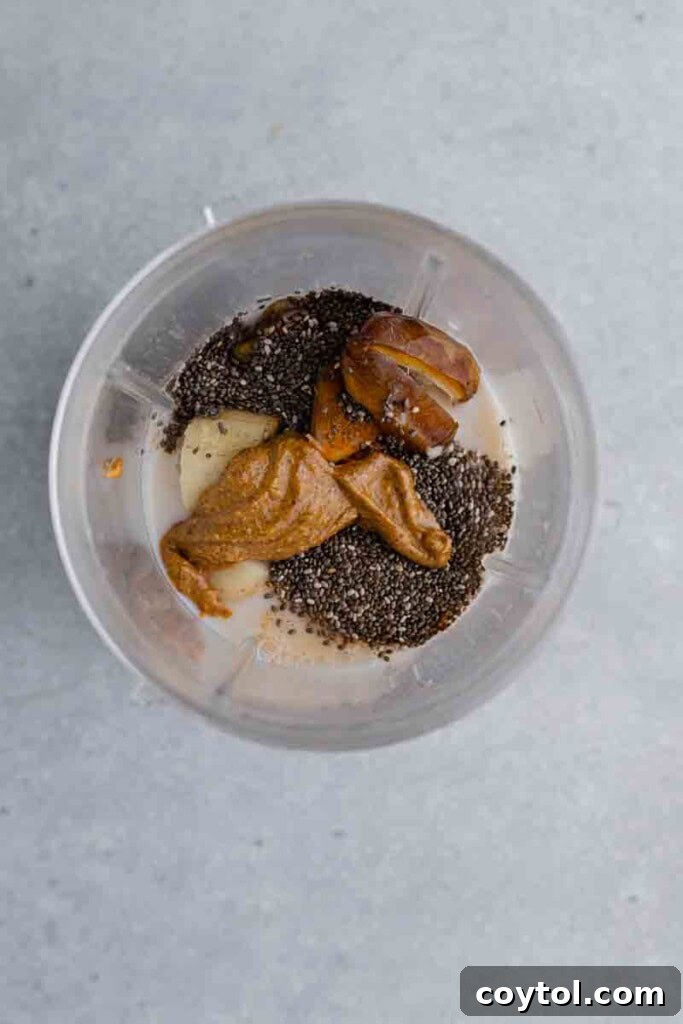 Golden Goodness Almond Banana Date Smoothie 4 Ingredients for a healthy smoothie being added to a blender.