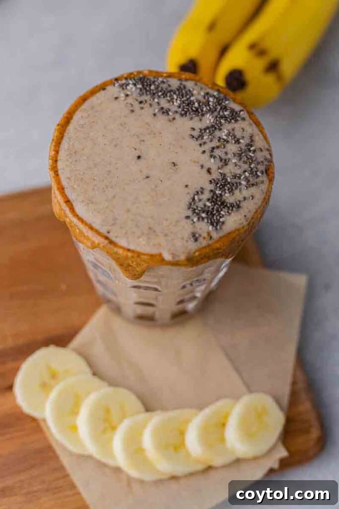 Golden Goodness Almond Banana Date Smoothie 5 A perfectly blended, creamy smoothie inside a blender.