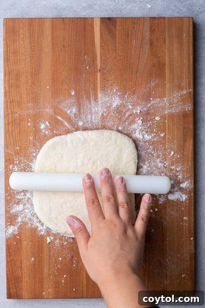 Hand rolling biscuit dough to desired thickness