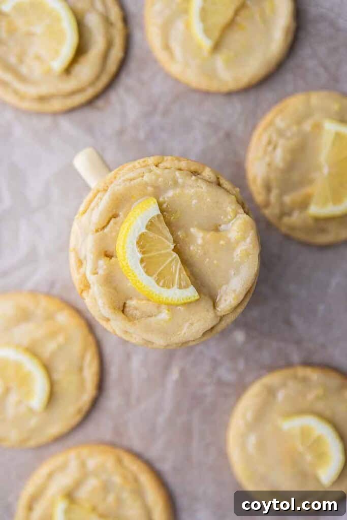 Effortless Bakery-Style Lemon Glaze Cookies 14 Overhead shot of CRUMBL Lemon Glaze cookies on a cooling rack