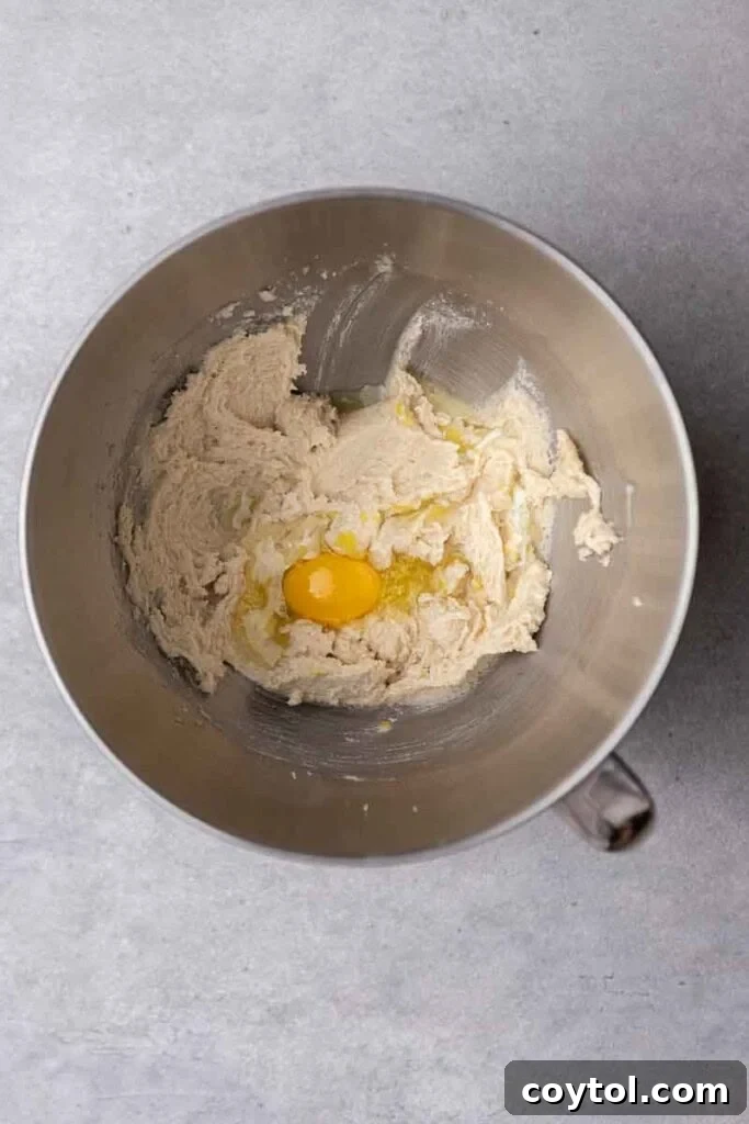 Effortless Bakery-Style Lemon Glaze Cookies 5 Creamed butter with egg and lemon juice in a mixer