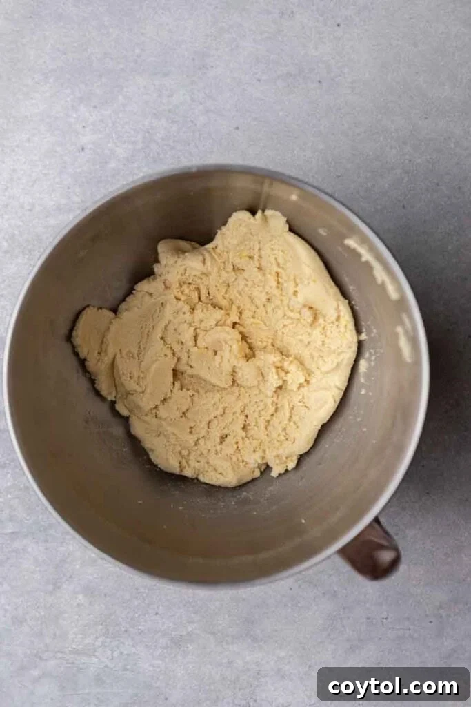 Effortless Bakery-Style Lemon Glaze Cookies 6 Cookie dough mixture in a stand mixer bowl