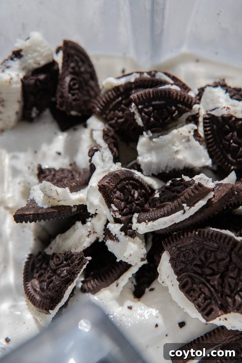 Crushed Oreos added to the blended ice cream and cool whip mixture.