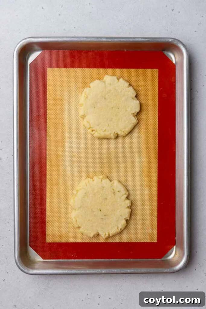 Zesty Island Chill Coconut Lime Cookies 12 Freshly baked cookies on a baking sheet.
