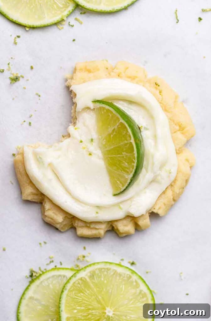 Zesty Island Chill Coconut Lime Cookies 14 Close-up of frosted CRUMBL coconut lime cookies ready to eat.