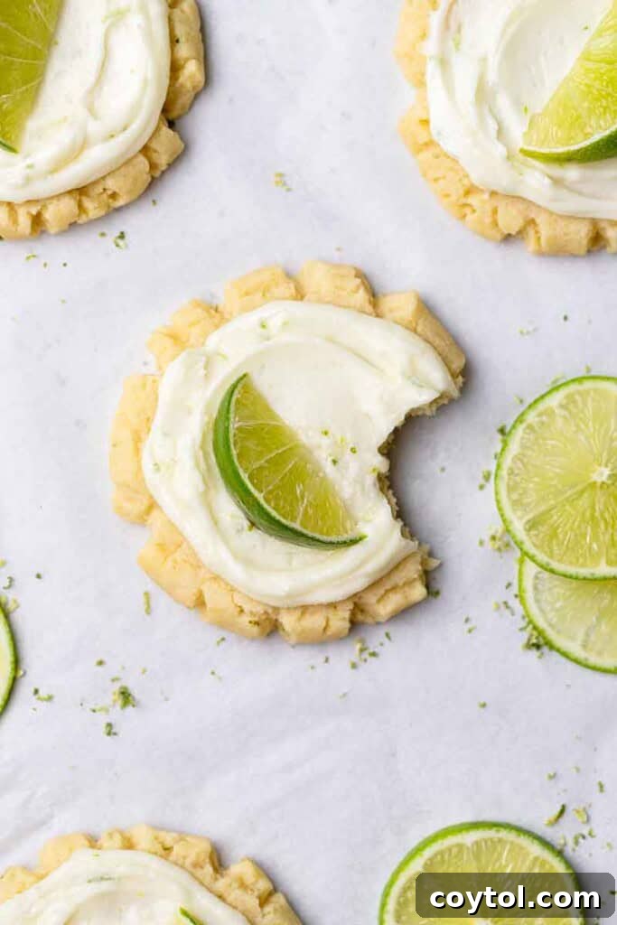 Zesty Island Chill Coconut Lime Cookies 3 Coconut cookie with tangy lime frosting and a fresh lime wedge garnish.